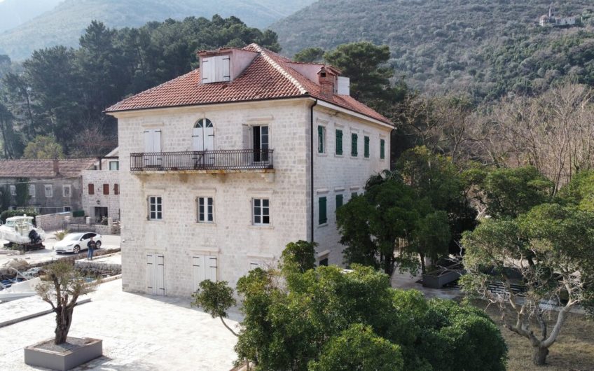 Ancient stone villa on the first line with a pier