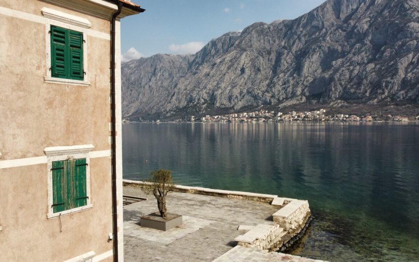 Ancient stone villa on the first line with a pier