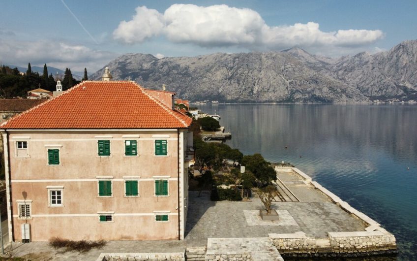 Ancient stone villa on the first line with a pier