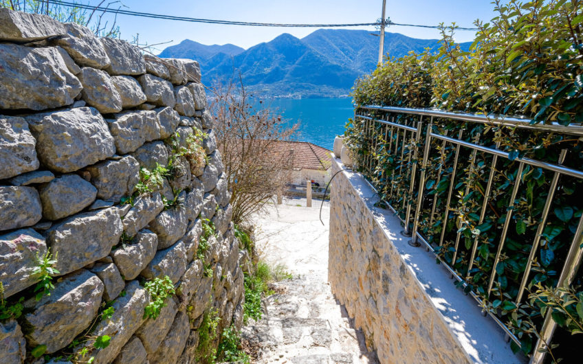 Plot of 1,938 m2 in Boka Kotorska with ancient stone buildings