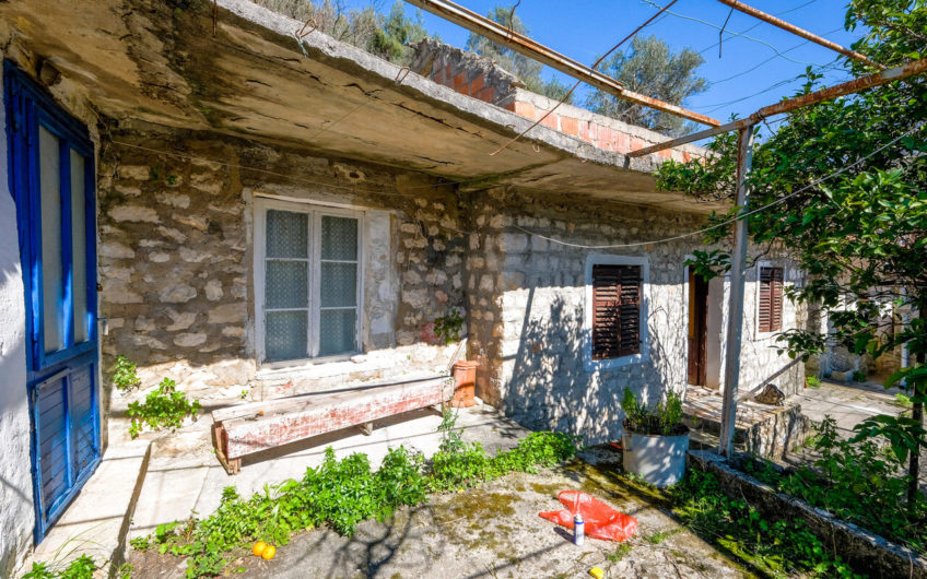 Plot of 1,938 m2 in Boka Kotorska with ancient stone buildings