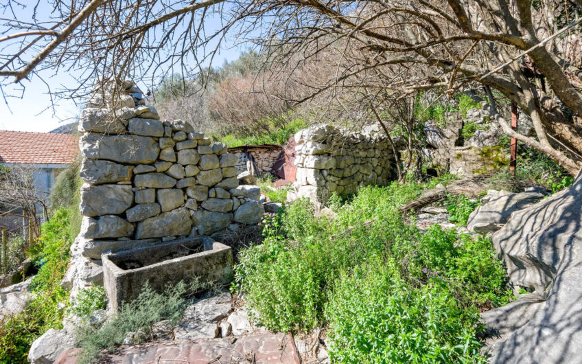 Plot of 1,938 m2 in Boka Kotorska with ancient stone buildings