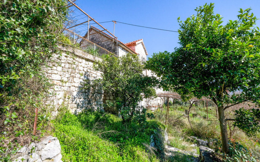 Plot of 1,938 m2 in Boka Kotorska with ancient stone buildings